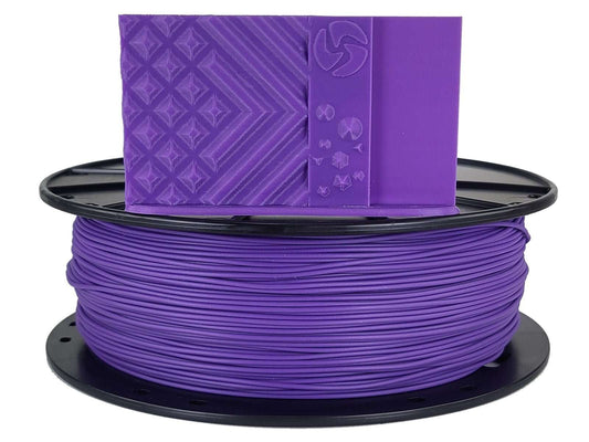 Spool of purple 3D printing filament with a branded box on top