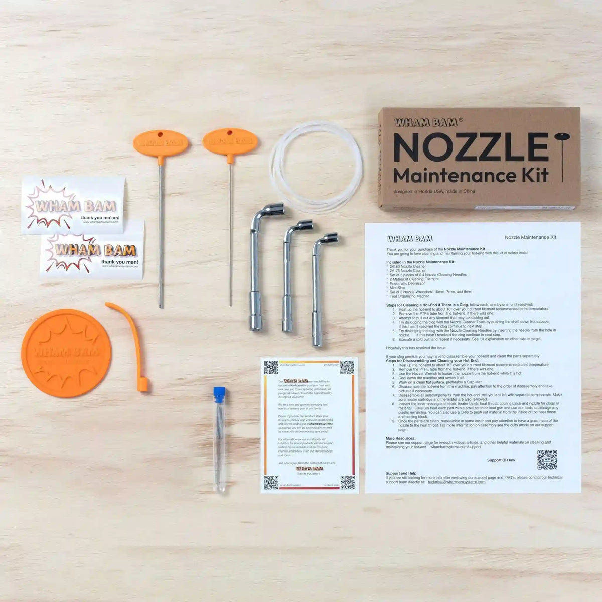 Wurm Bam Nozzle Maintenance Kit on a wooden surface with various components and documentation.