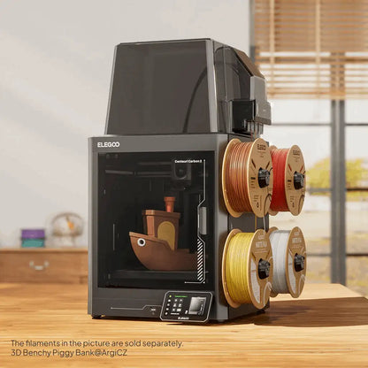 3D printer with filament spools on a wooden table