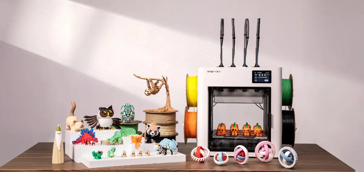 3D printer with various printed objects on a table
