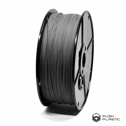 Spool of gray filament on a white background with 'Push Plastic' branding.
