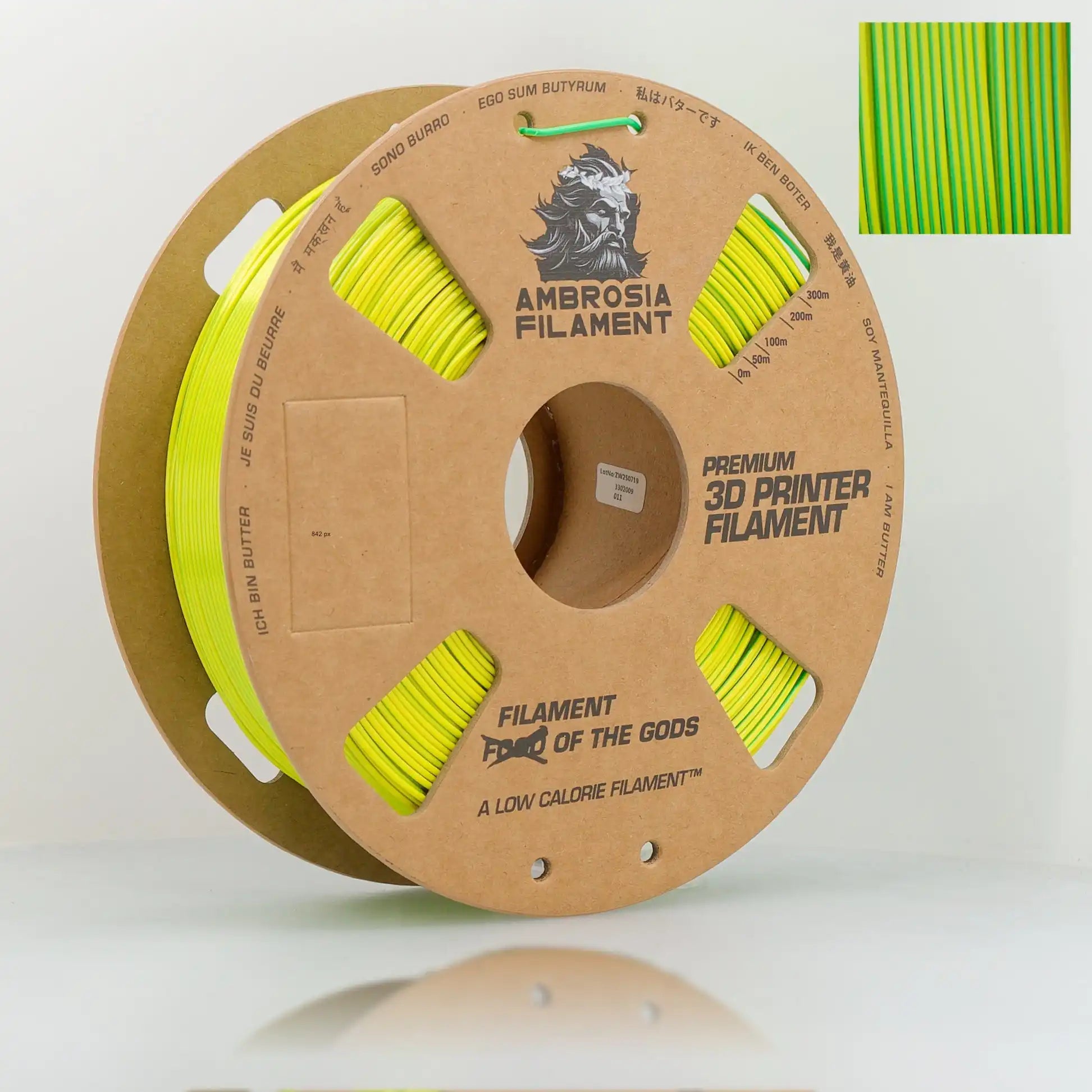 Spool of Ambrosia Filament with green 3D printer filament on a white background