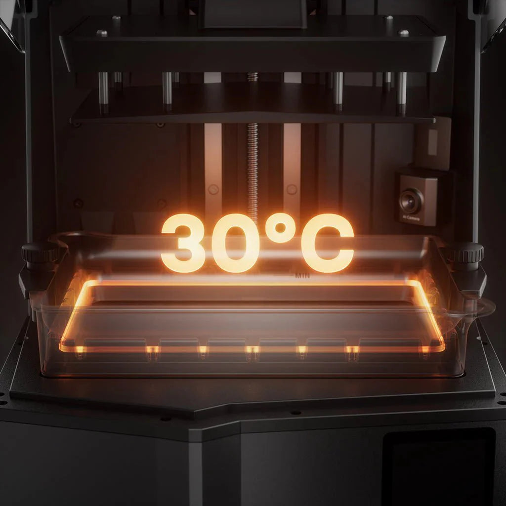 3D printer with a digital display showing 30°C temperature inside a clear enclosure.
