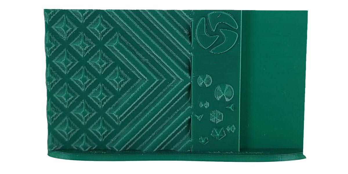 Green fabric with geometric patterns and a logo on a white background