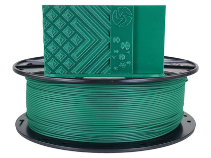 Spool of green filament with a green label on a white background