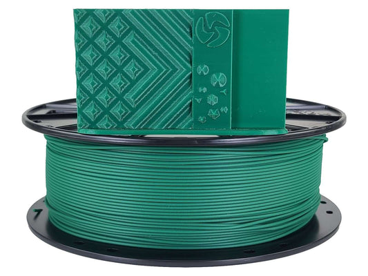 Spool of green filament with a green label on a white background