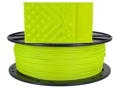 Spool of bright green filament on a black spool with a white background