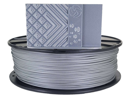Spool of gray filament with a box labeled 'PLA' on a white background