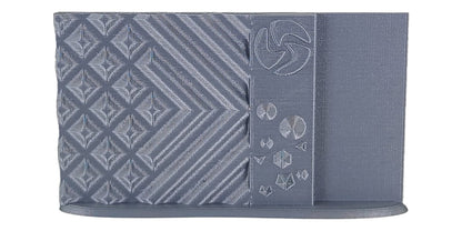 Gray patterned fabric with geometric designs on a white background