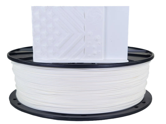 Spool of white filament with a piece of paper on top against a white background