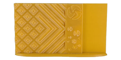 Yellow textured pouch with geometric patterns on a white background