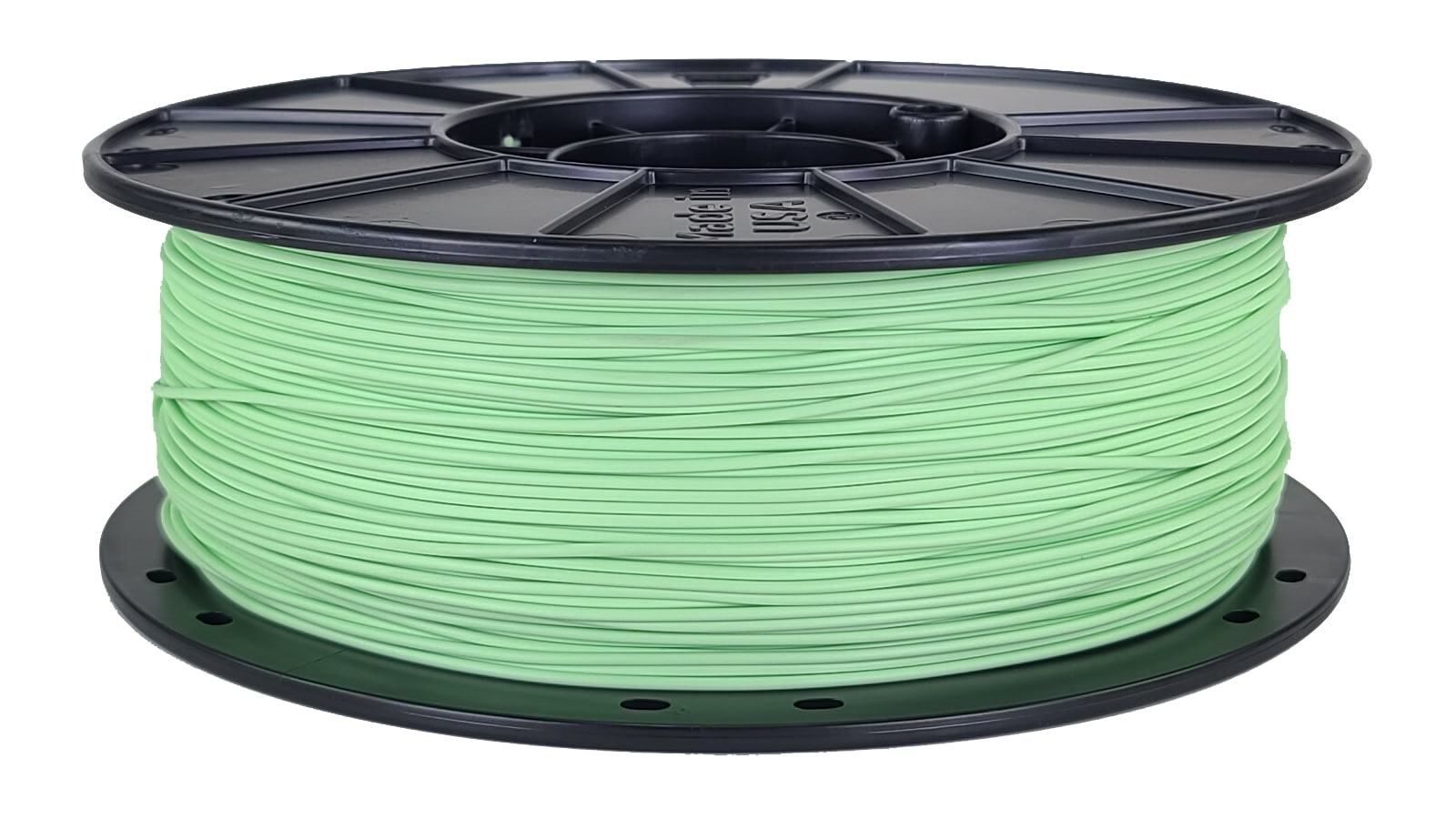 Spool of green filament on a white background