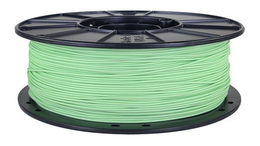Spool of green filament on a white background