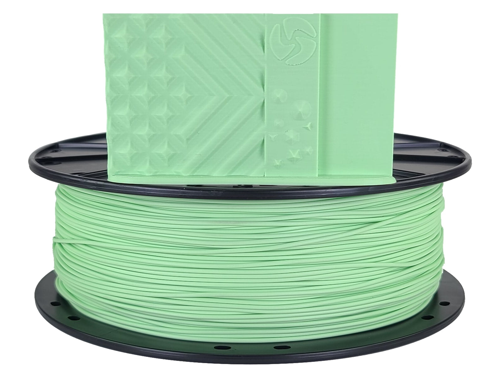 Spool of green filament on a white background