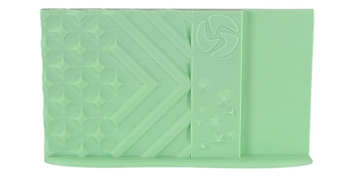 Light green fabric with a geometric pattern on a white background