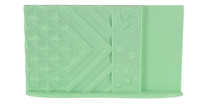 Light green fabric with a geometric pattern on a white background