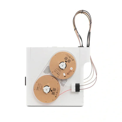 Two brown circular components with wires on a white background