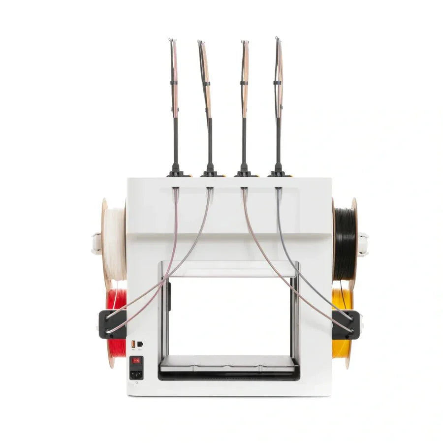 White machine with multiple spools and wires on a white background