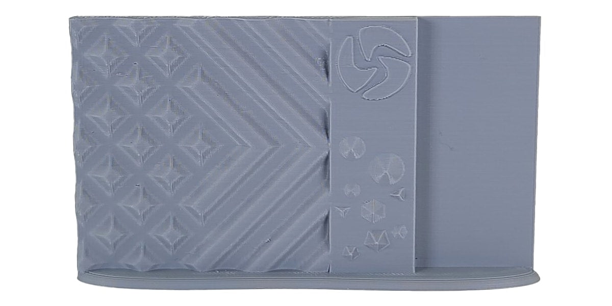 Gray silicone mold with geometric patterns on a white background