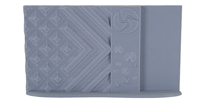 Gray silicone mold with geometric patterns on a white background