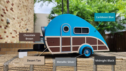 Model of a camper with color swatches labeled 'Caribbean Blue', 'Chocolate Brown', 'Desert Tan', 'Metallic Silver', and 'Midnight Black'.
